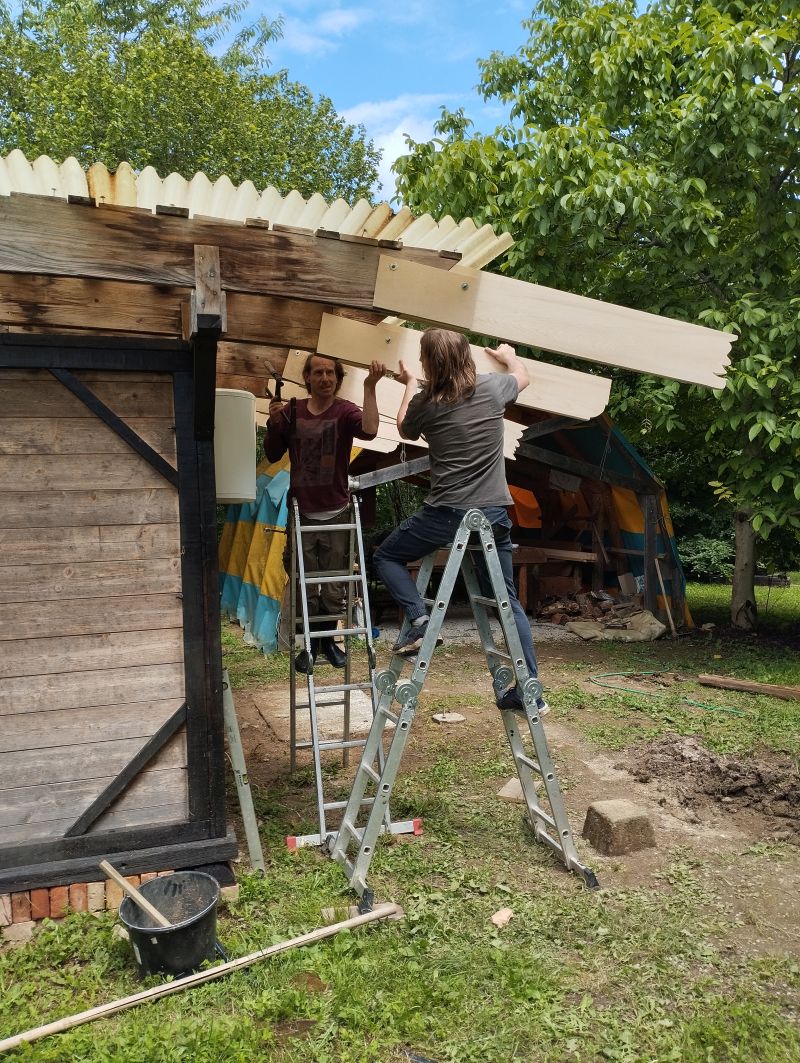 Constructing a roof extension on the outdoor showers